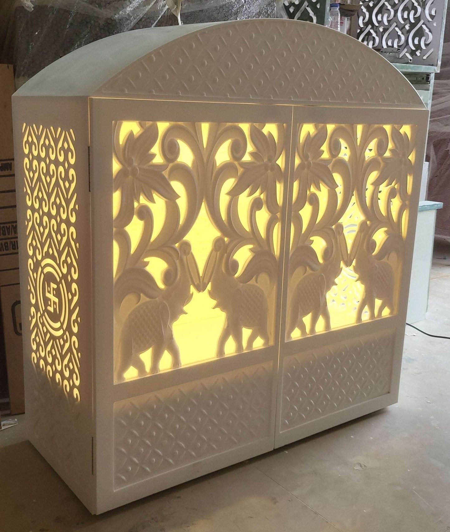 Corian mandir compact design with carving doors and rounded top - Home temple