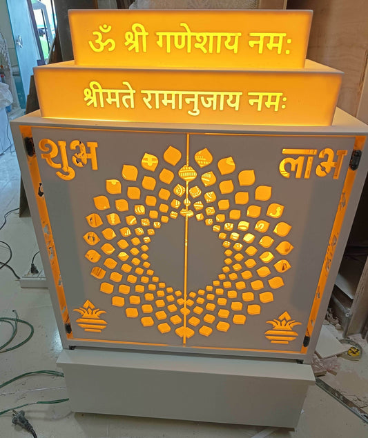 Compact corian home temple with pocket doors and backlit balaji - Home temple