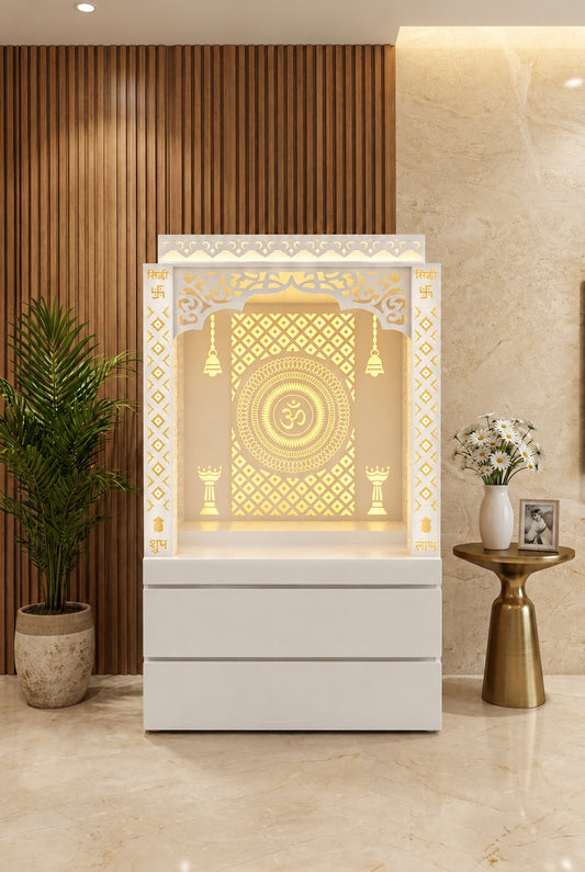 White Corian mandir with warm backlit Om panel and storage, front view in a luxury interior