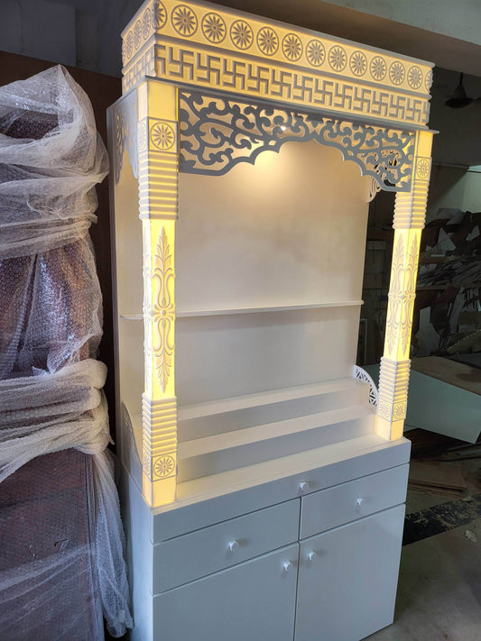Corian mandir for home with pillars and laminated cabinet storage - Home temple