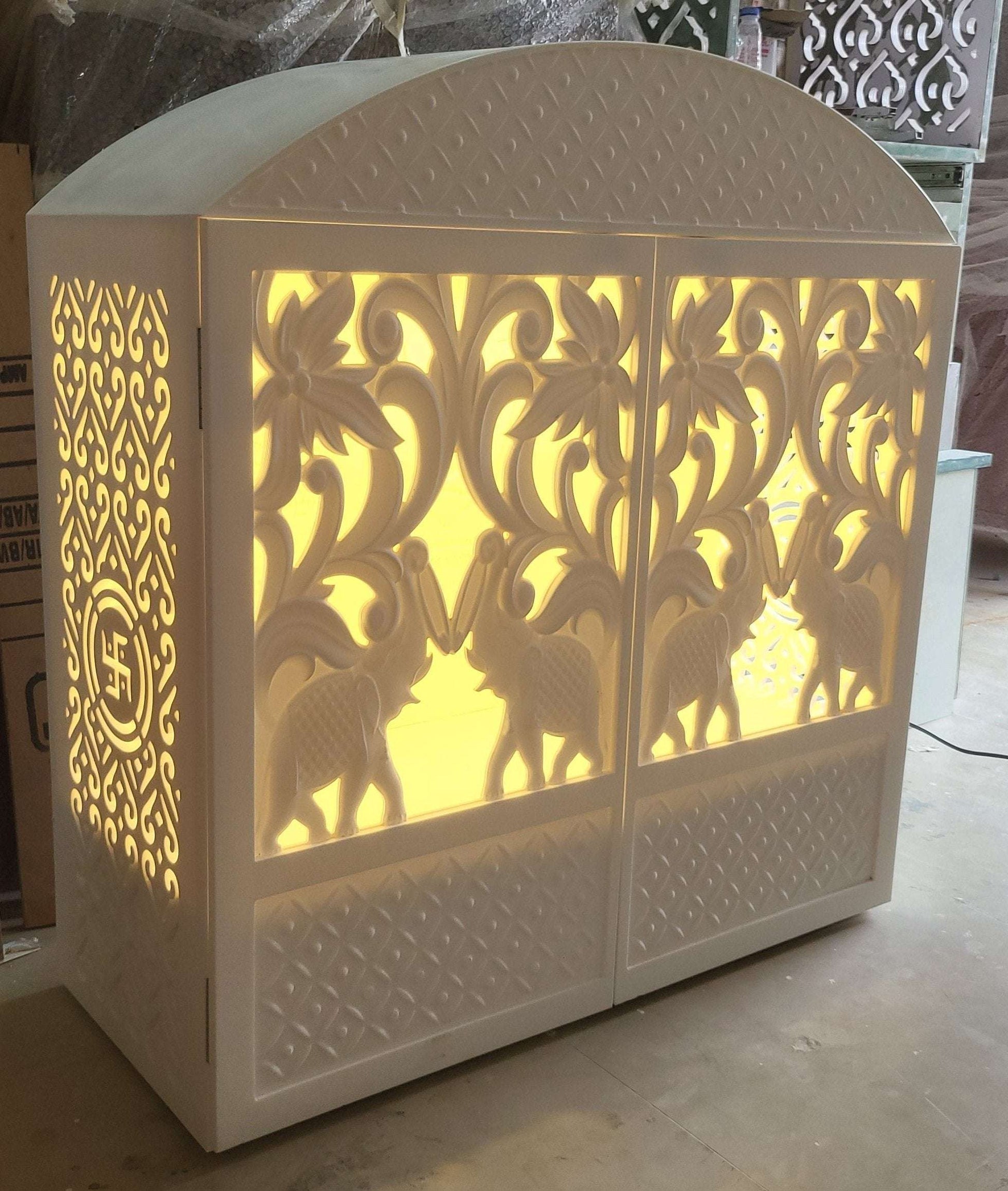 Corian mandir compact design with carving doors and rounded top corian mandir mumbai