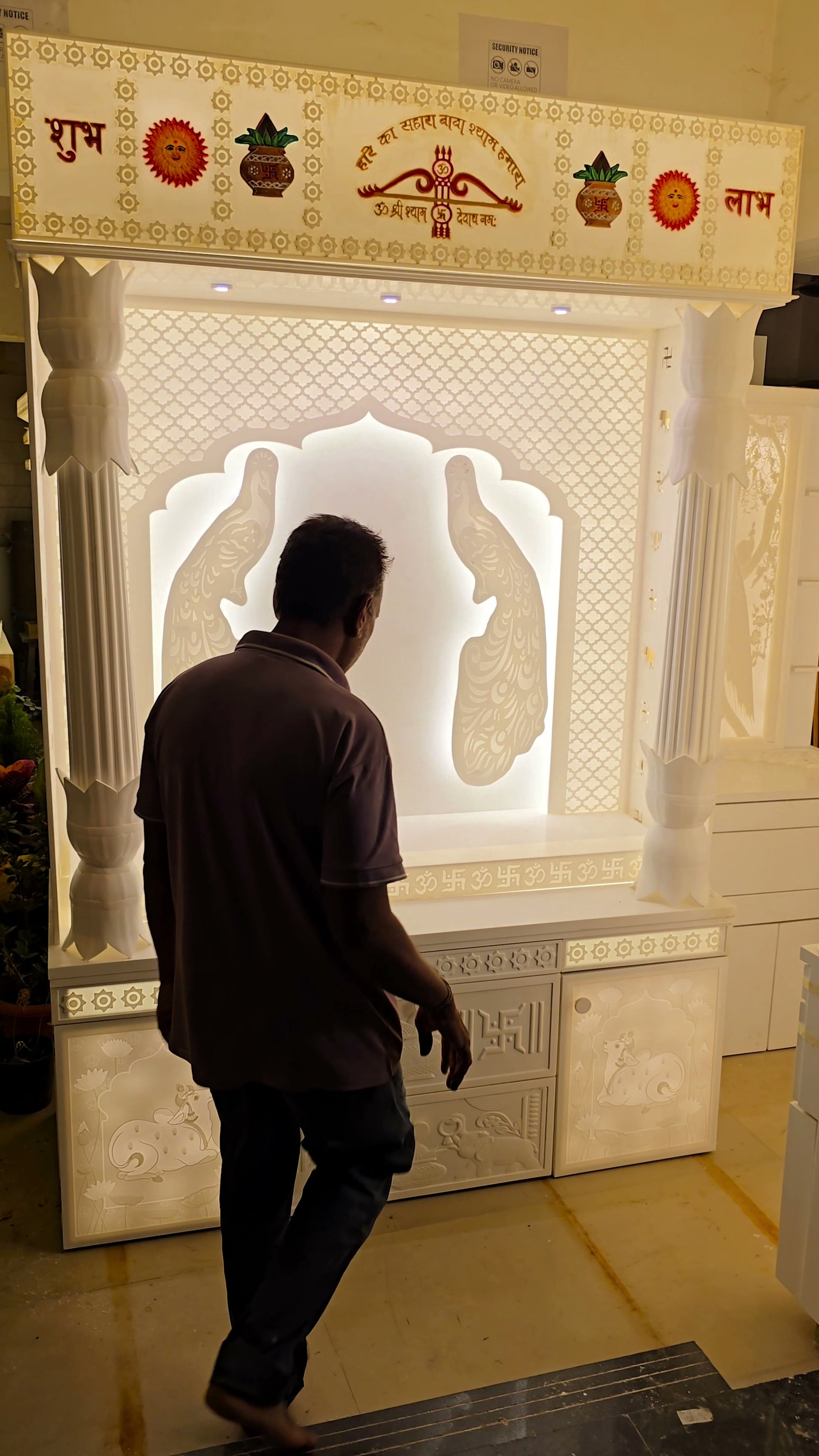 Daily aarti view of premium 8ft Corian mandir with backlit deity niche