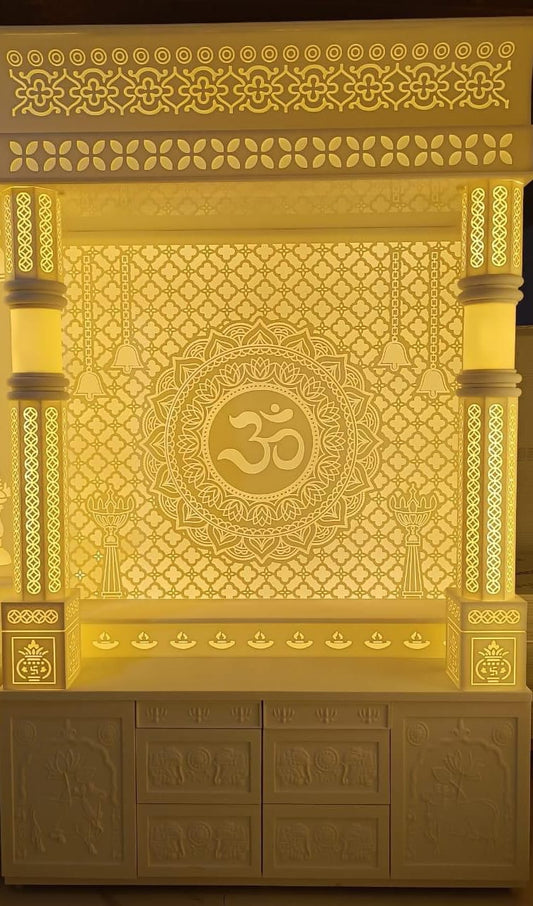 Corian mandir with intricate carvings and warm white lighting