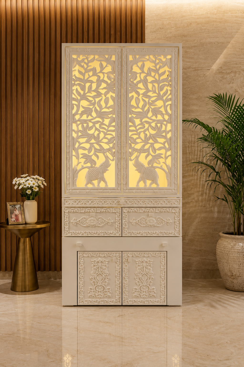 White Corian mandir with carved backlit shutter doors closed, tree-of-life and elephant cutwork glowing - Satguru Creations - Corian temple collection