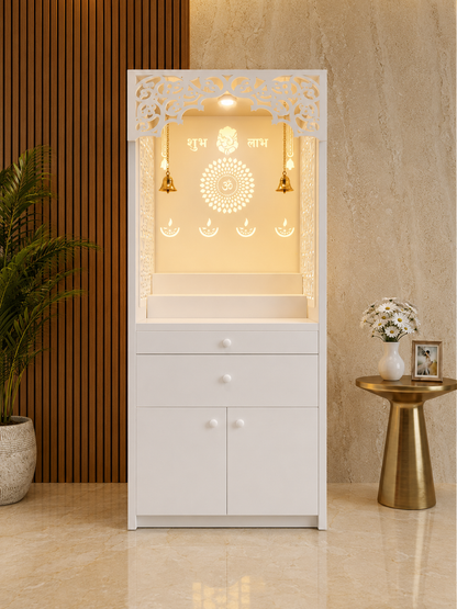 Front view of a backlit white Corian mandir with Shubh Labh motifs, altar steps and storage