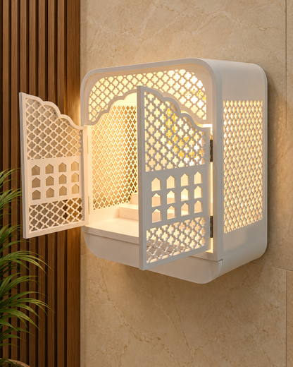 Three-quarter view of the rounded Corian mandir with open jaali doors and illuminated side panel; digitally styled background from the original side view.
