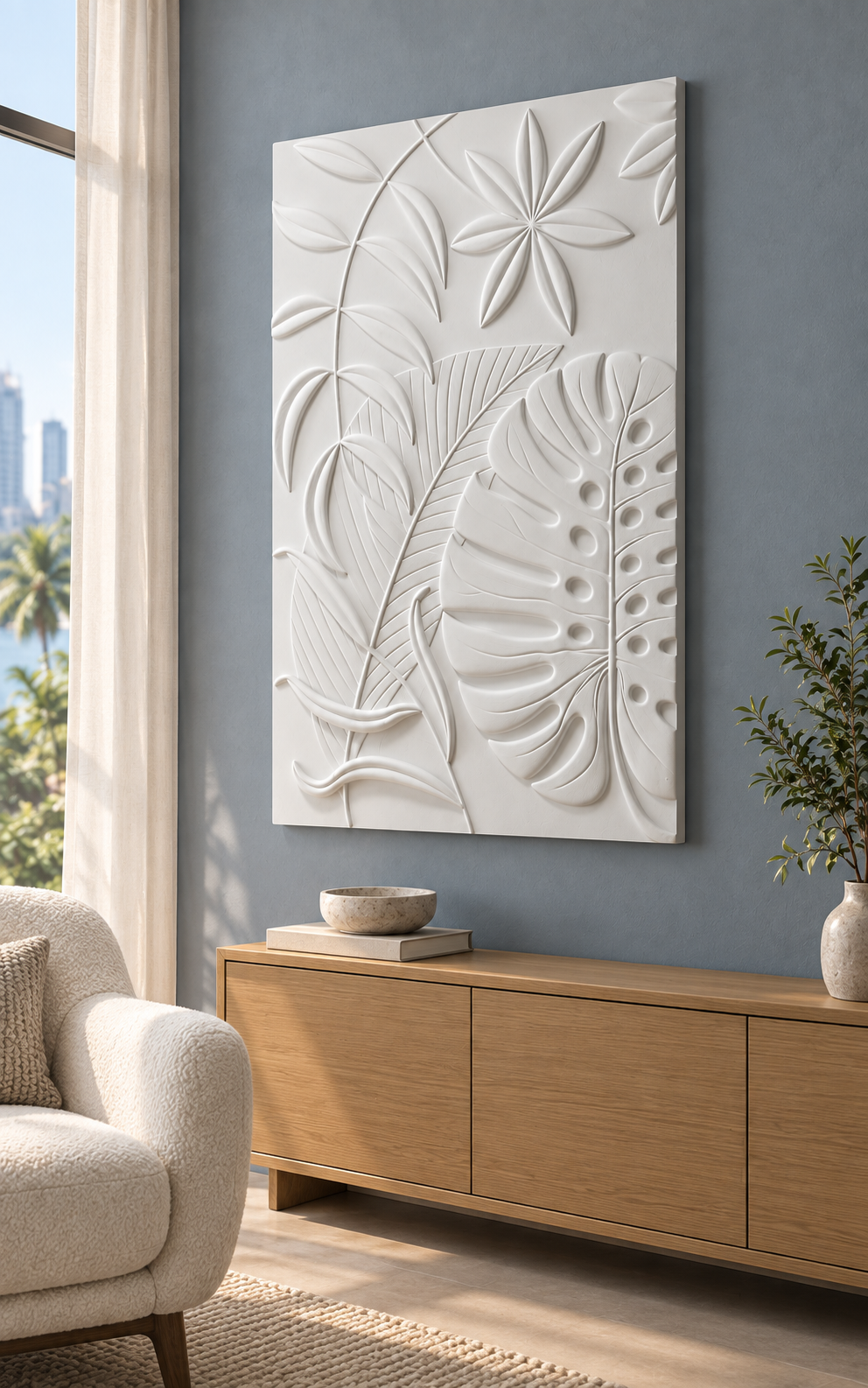 Monstera Lance Leaf Tapestry Corian wall panel, right view in a Bandra apartment reading corner with a blue-grey wall and cream boucle chair