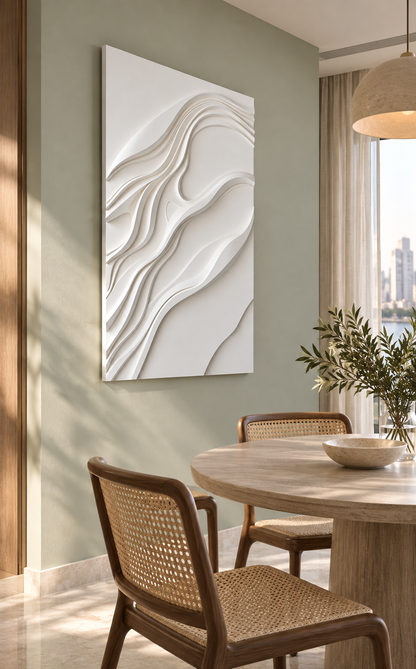 Diagonal Current Layers satin white Corian wall panel left view in luxury Mumbai dining area with soft celadon wall, round ash table and cane dining chairs