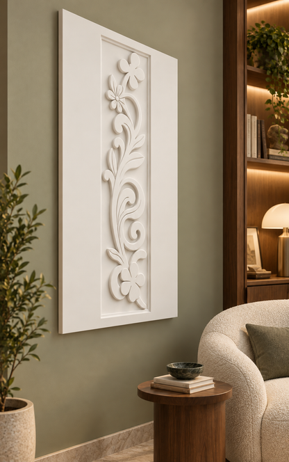 Floral Scroll Trail Corian wall panel, left view in a Mumbai living-room reading corner, showing its satin white shallow relief.