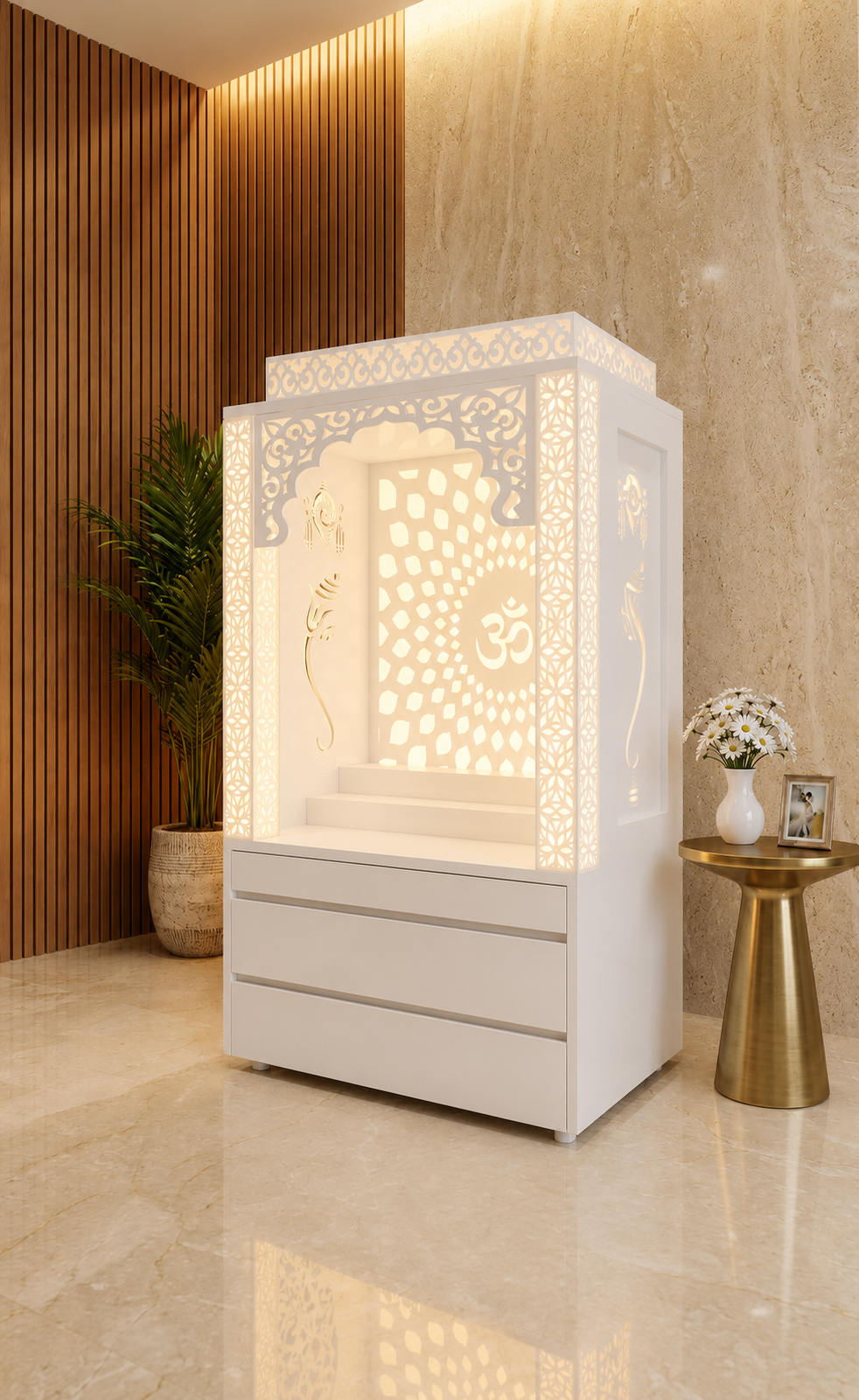 Angled fully white Corian mandir with illuminated pillars, Om sunburst and three handleless drawers