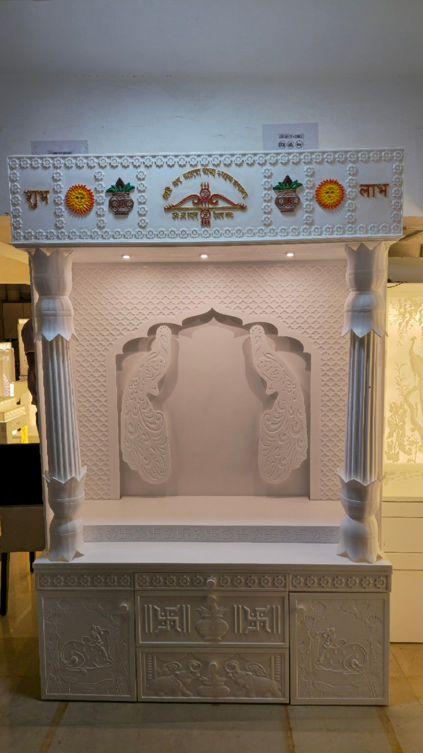Original front photograph showing the peacock relief and 24-inch carved storage without backlighting