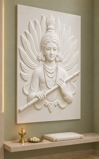 Krishna Flute Feather Aureole satin white Corian wall panel, left view in a muted sage Mumbai prayer alcove with a pale stone shelf.