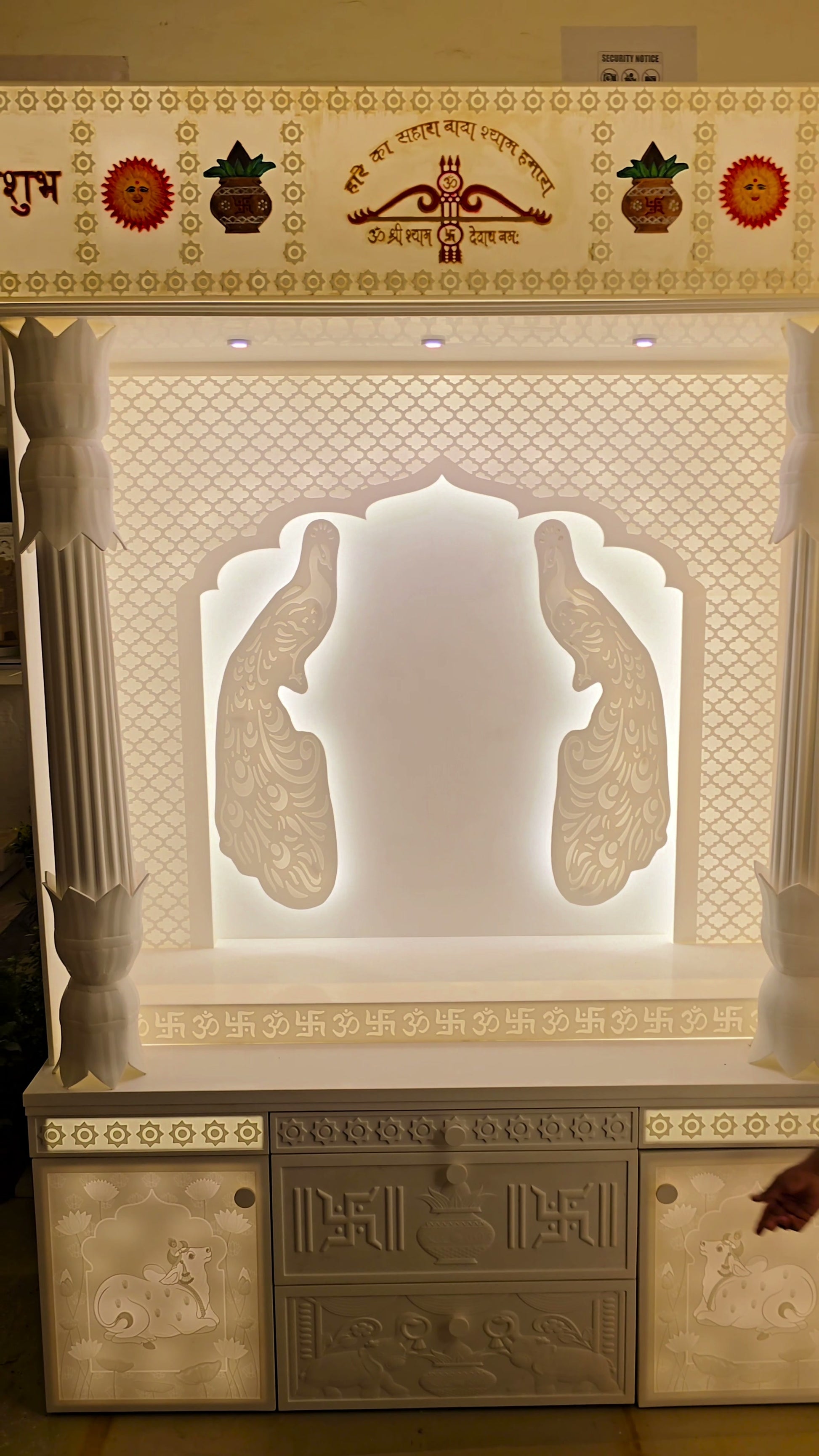 Hand-carved Nandi panel on side hidden storage drawer