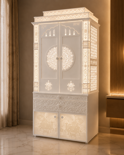 Angled view of the double-door Corian mandir with illuminated pillars, side jali panels and carved lower storage