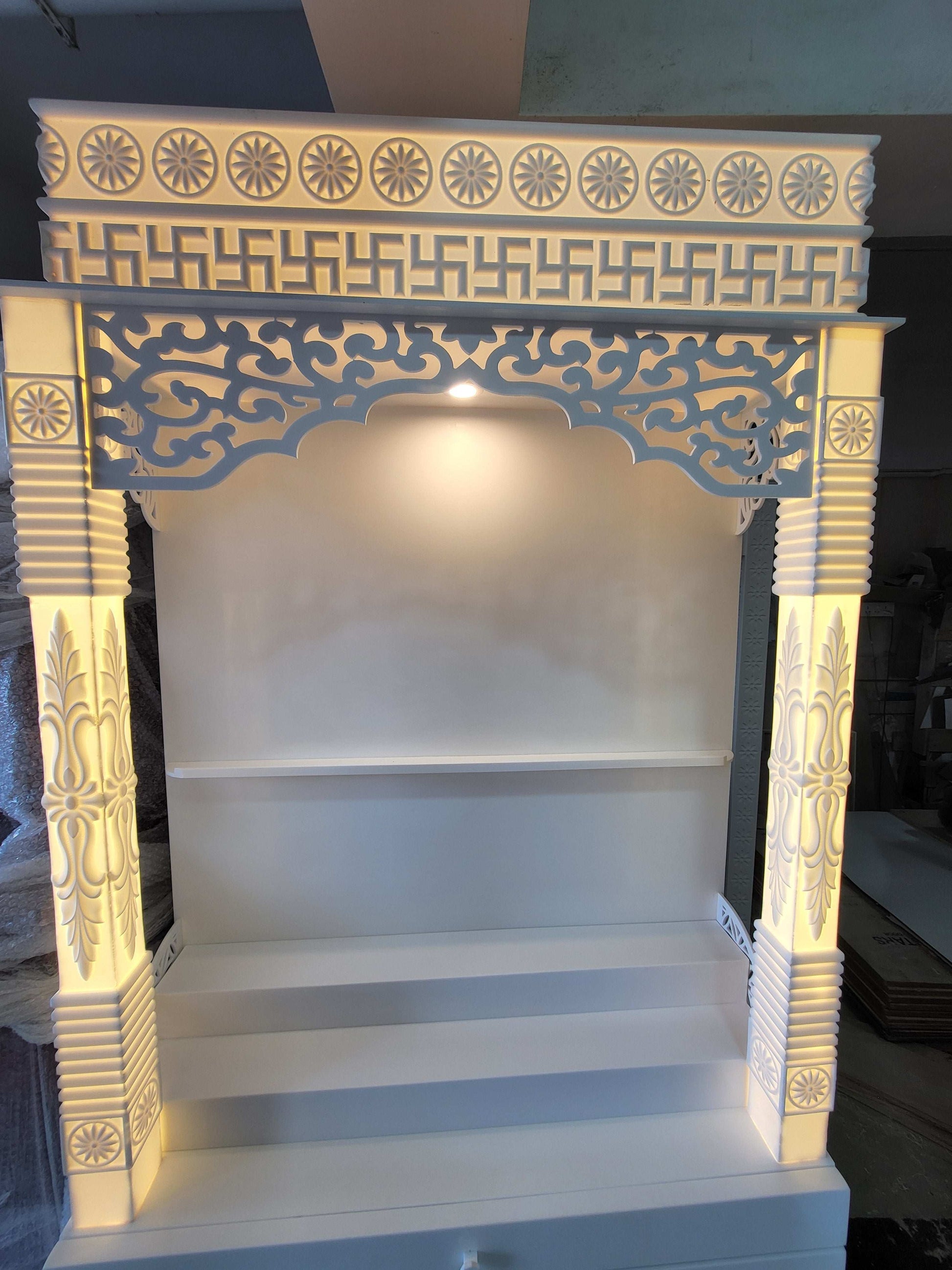 Corian mandir for home with pillars and laminated cabinet storage corian mandir mumbai