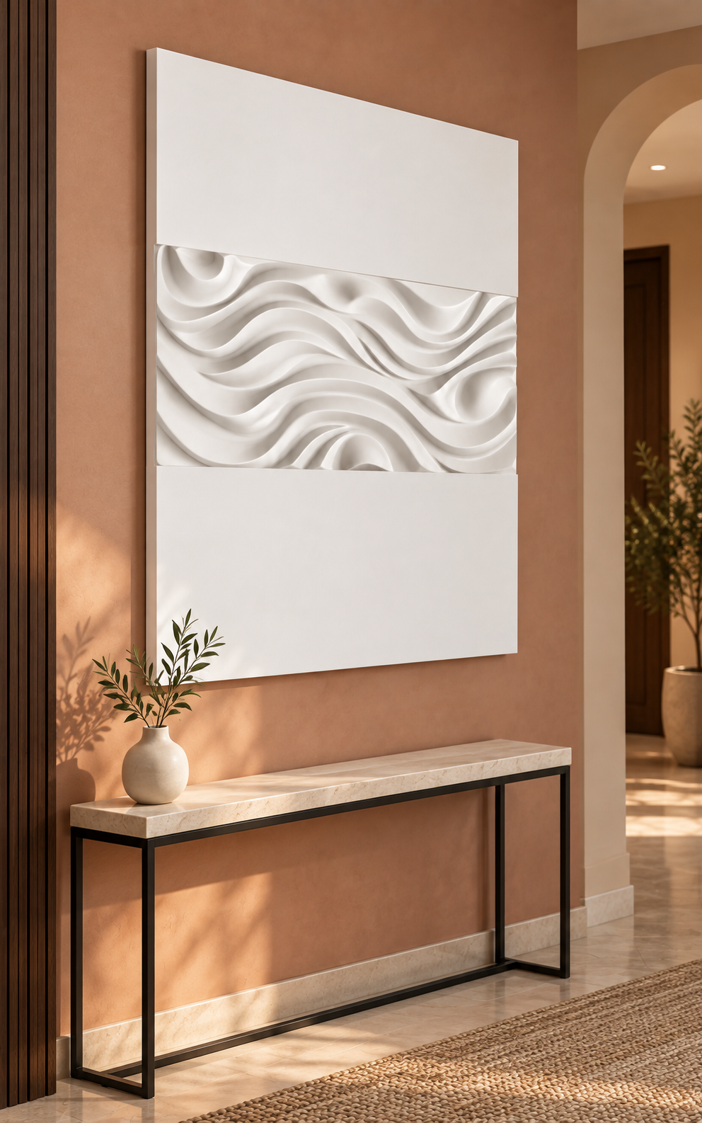 Rolling Wave Troughs satin white Corian wall panel, left view in a terracotta Mumbai entry vestibule with a stone-topped console.