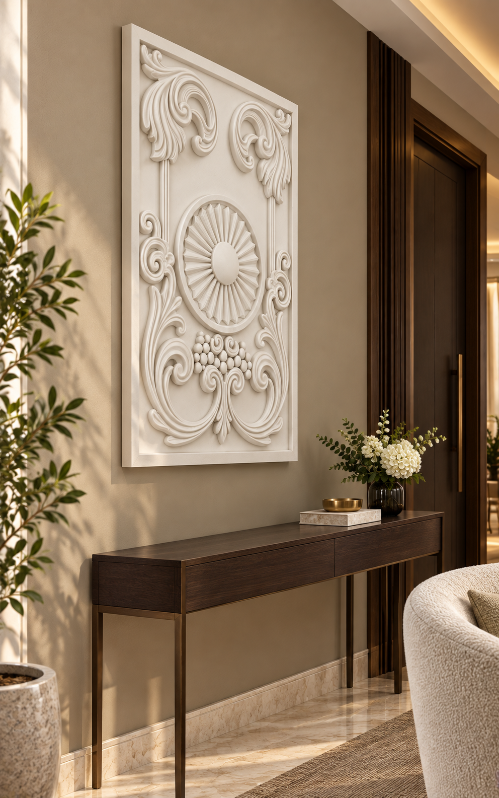 Sunburst Scroll Cartouche satin white Corian wall panel left view in luxury Mumbai entrance lounge with warm taupe wall, slim dark oak console and boucle accent chair