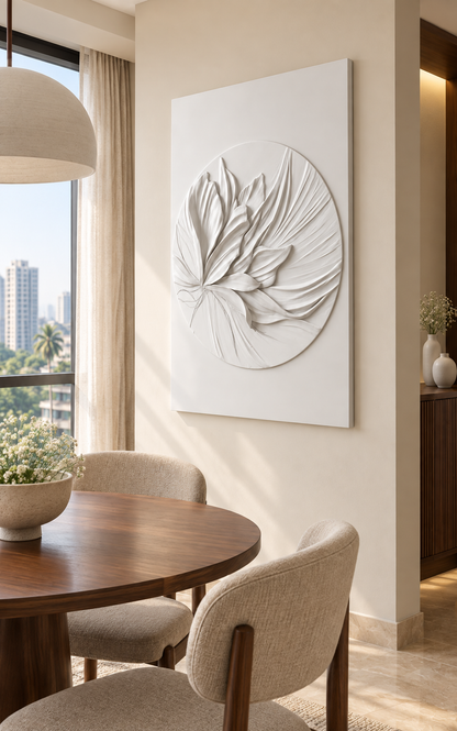 Swept Petal Medallion Corian wall panel, right view in a Mumbai dining nook with an ivory wall, round walnut table and linen chairs.
