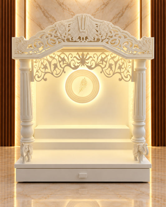 Front view of the traditional Corian mandir with ornate arch, round fluted pillars, elephant bases and backlit feather medallion. Reference-guided styled visualization.