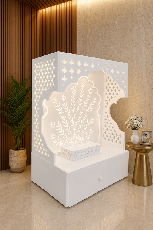 Angled white Corian home mandir showing floral tree panel, curved opening and side jhaali